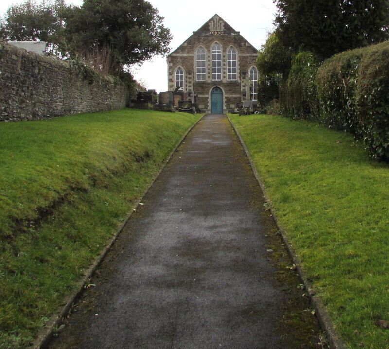 Trinity, Pontarddulais. The church is set back 55 metres from the A48 St Teilo Street. Trinity is the only English word on the Welsh language information board, which shows EGLWYS FETHODISTAIDD (Methodist Church).