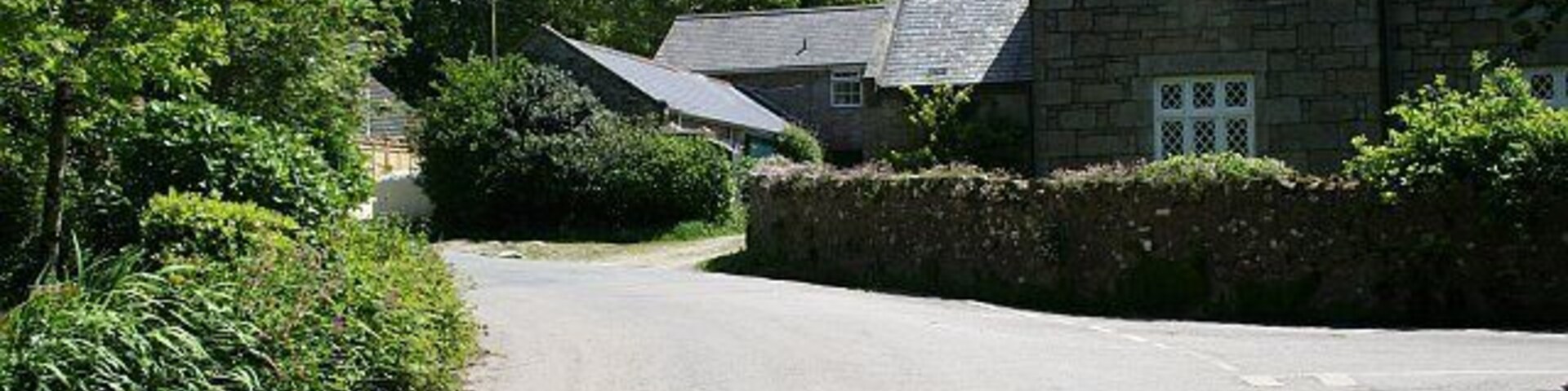 Stennack. Stennack is a hamlet in a wooded valley on the western edge of Troon.