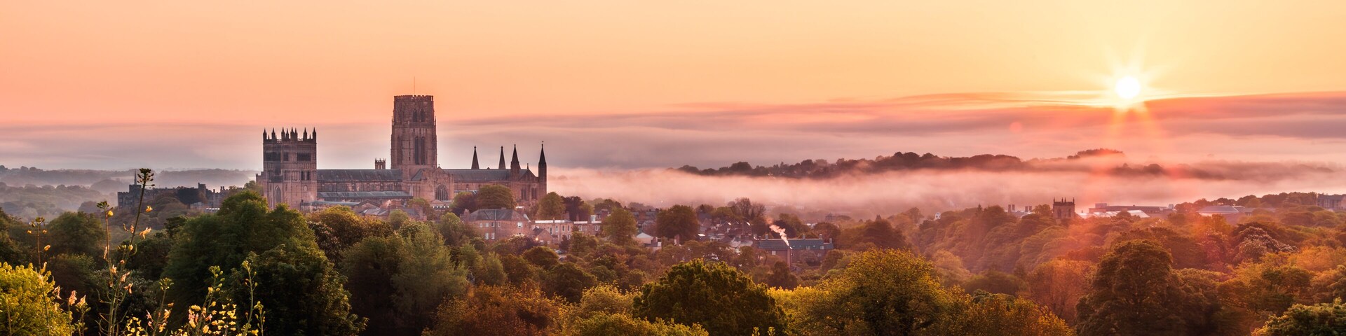 The view of the Durham Cathedral in the sunrise and mist from the Observatory Hill