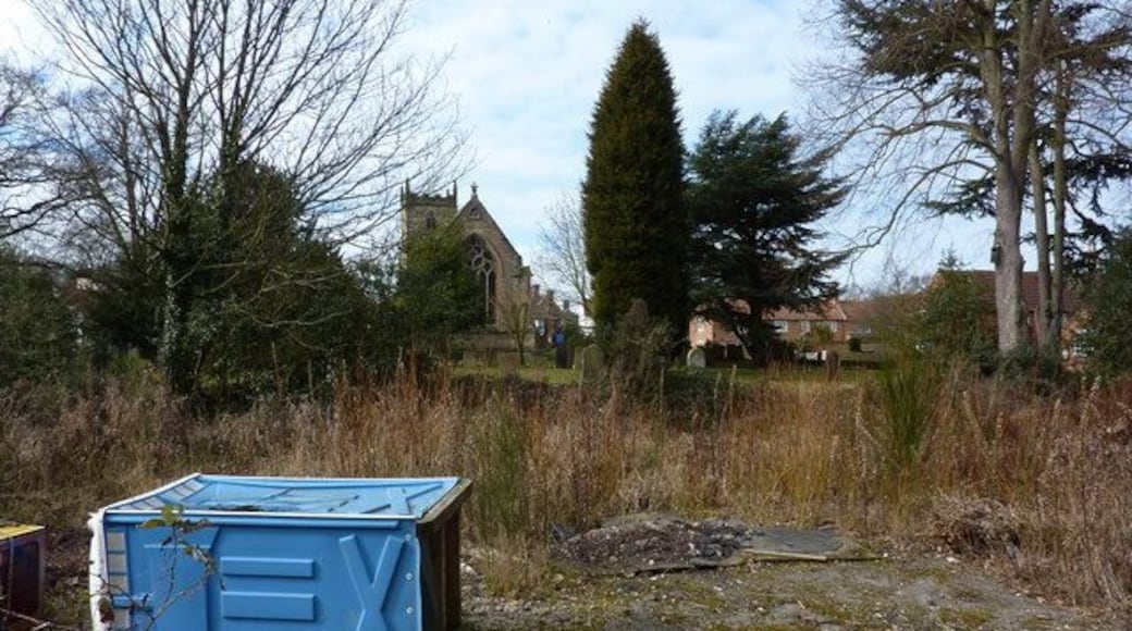 Village church and some rubbish The site of the former Co-op shop, I'm told, in the village of Woodborough.