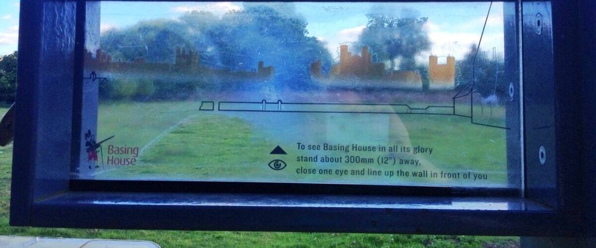 A sign with instructions to view Basing House from 300mm away.
