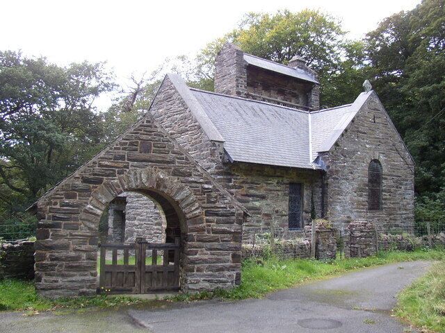 St Philip's church, Caerdeon, near Bontddu, Gwynedd. The church has four bells in a row, all rung simultaneously by a pulley on ground level at rear of church, with cables rotating a beam connected to each bell. The mechanism is just visible.
