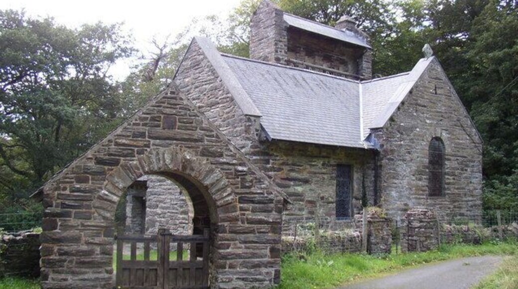 St Philip's church, Caerdeon, near Bontddu, Gwynedd. The church has four bells in a row, all rung simultaneously by a pulley on ground level at rear of church, with cables rotating a beam connected to each bell. The mechanism is just visible.