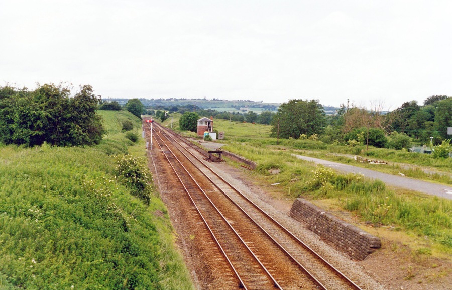 Site of Dorrington station, 1993. View northward, towards Shrewsbury: ex-GW&LNW Joint Hereford - Shrewsbury main line. The station closed to passengers 9/6/58, to goods 15/3/65, but the Marches Main Line flourishes.
