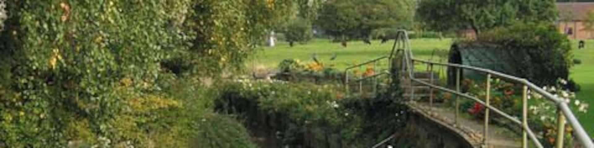 River Devon at Bottesford. The river passes through the north side of the village and in front of the church (St Mary the Virgin) Taken from the footbridge over the ford in 614083.