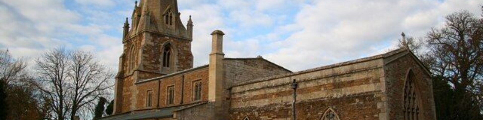 St.John the Baptist's church A delightful combination of warm ironstone and cold grey limestone, with 13th century arcades, 14th century tower & broach spire and 15th century south aisle