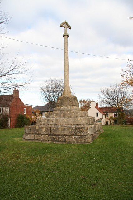 Stone cross on the green in Muston, Leicestershire