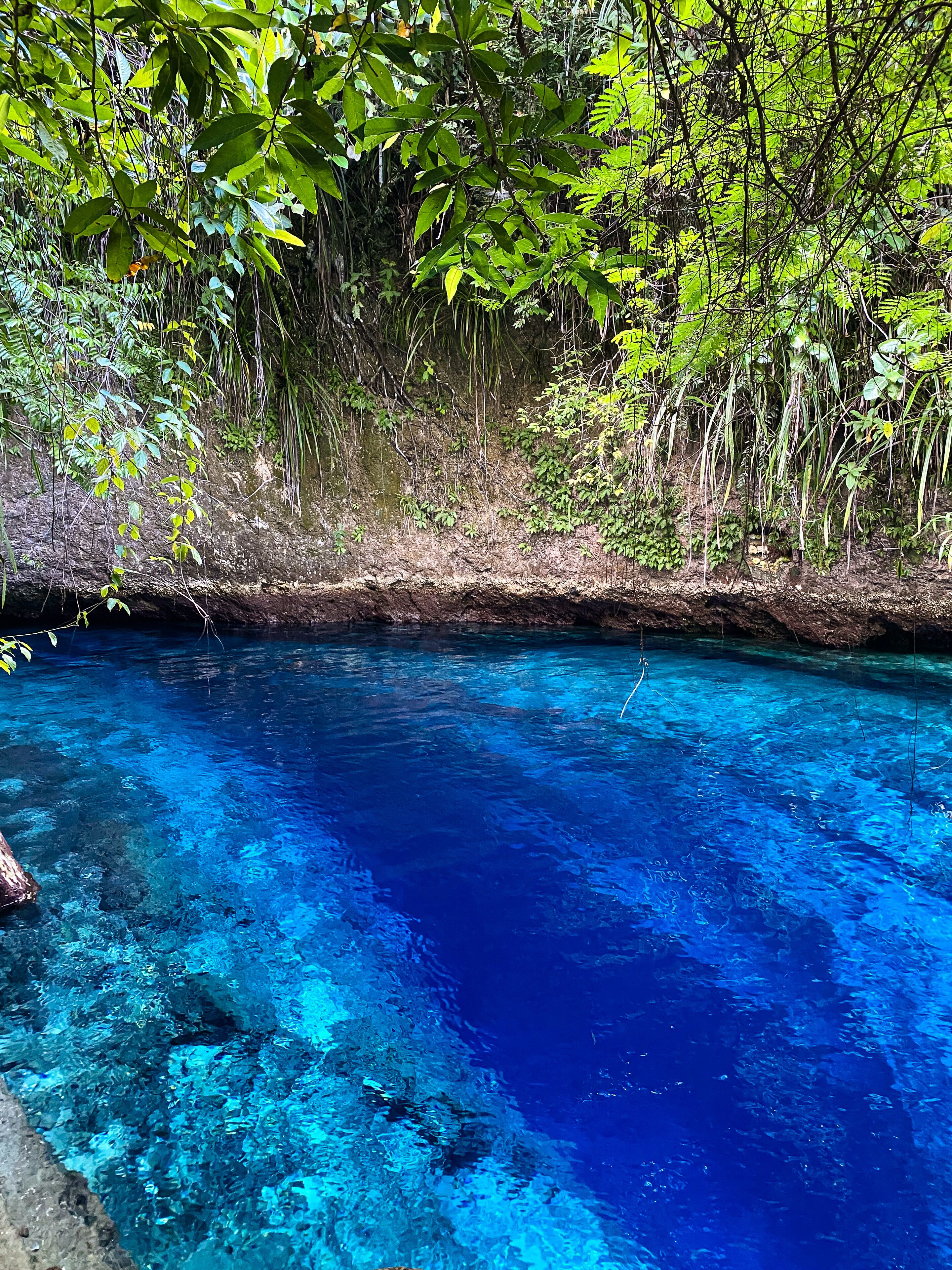 Blue water in Hinatuan Enchanted River. Surigao del Sur. Philippines.