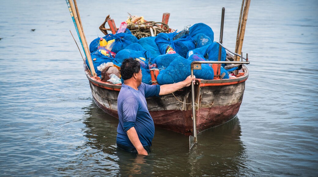 Local fishermen are about to take a boat out to sea to fish at Ban Bang Phra, Thailand