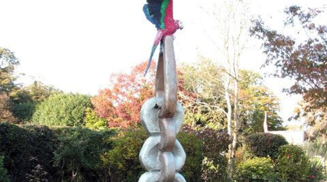 Memorial to Sammy. Sammy was a girl who was born with cerebral palsy. When she died, aged 13, a sculpture was put up in her memory beside the Kings Head public house > 1025721 which she used to like visiting, in the company of her parents. The sculpture was created from one single piece of wood by a wood carver from the nearby village of Morston - the parrot perched on top resembles a much loved feathered friend of Sammy's.