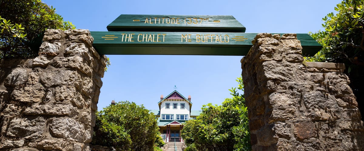 A stone pathway leading to a building with a sign reading "The Chalet M. Buffalo" and an altitude marker of 1337 feet.