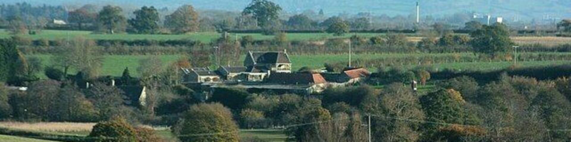 Stowford Farm the long view Stowford Manor Farm is on the A366 east of Farleigh Hungerford. In this view Staverton can be seen to the right in the distance. for more about the farm http://www.stowfordmanorfarm.co.uk/index.htm