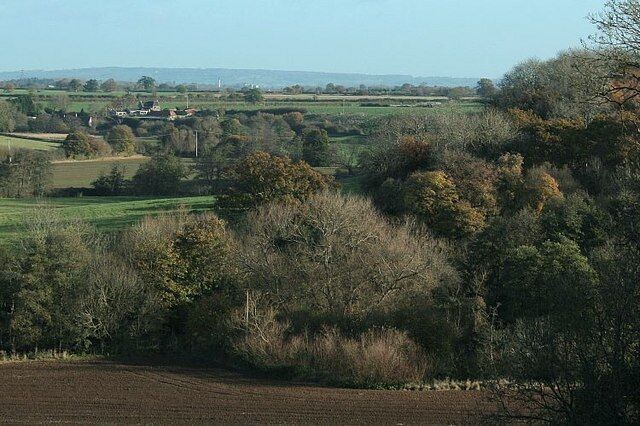 Between Farleigh Hungerford and Tellisford There are some fine views to be had in this area for those prepared to look for them. This one looks north east. The factory at Staverton can just be seen and the group of buildings to the left is Stowford. The River Frome crosses the line of sight three times between here and Stowford but stays well hidden in the trees.