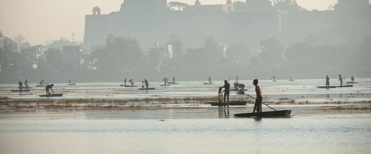 Fishermen catching fish at lake in Dhar city of madhya pradesh state. India.