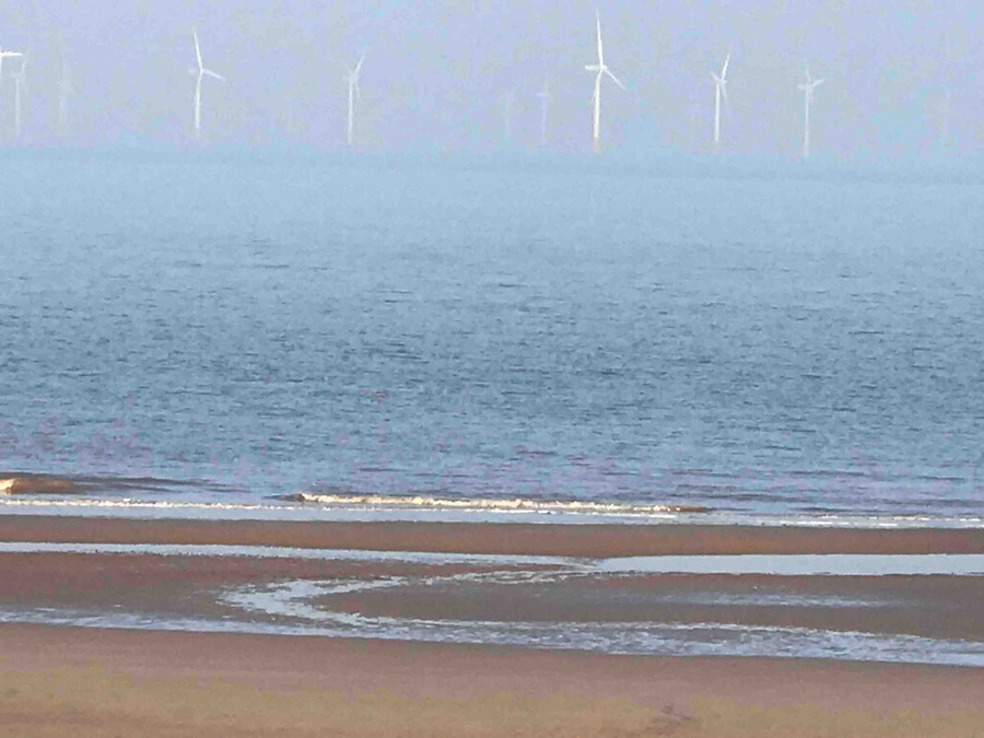 Serene giant turbines changing the views.