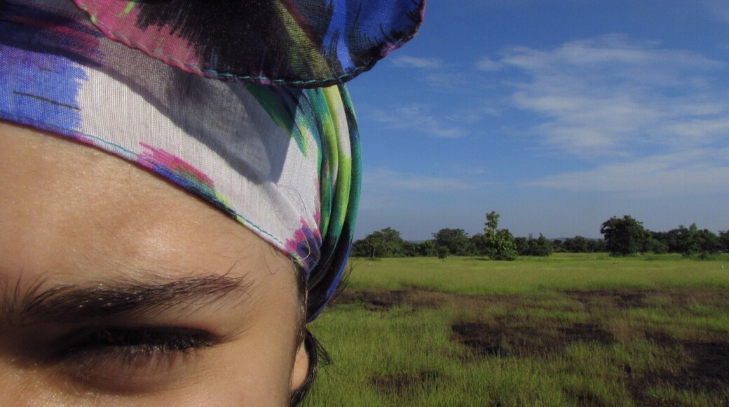 Behind the plantation land owned by Maachli, there begins an upward forest trail that leads from a canopy of trees to this open landscape of blue vs green.
A shot of my 12 year old sister, Ryanna, eyes squinted by the Sun.