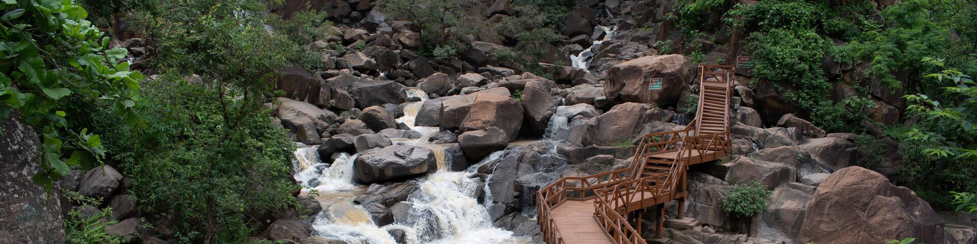 picturesque wooden footbridge constructed across "burah river" gorge at "lodh waterfalls" inside "palamou tiger reserve", latehar , jharkhand, india
