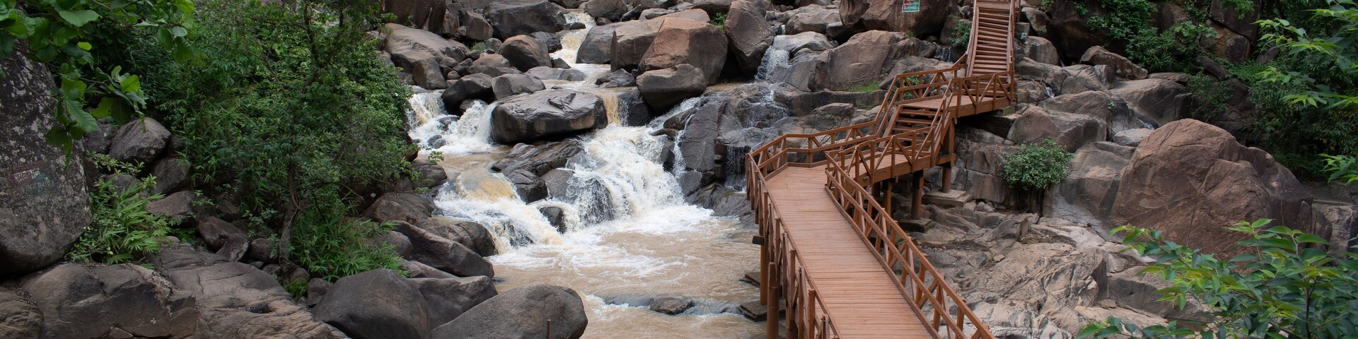 picturesque wooden footbridge constructed across "burah river" gorge at "lodh waterfalls" inside "palamou tiger reserve", latehar , jharkhand, india