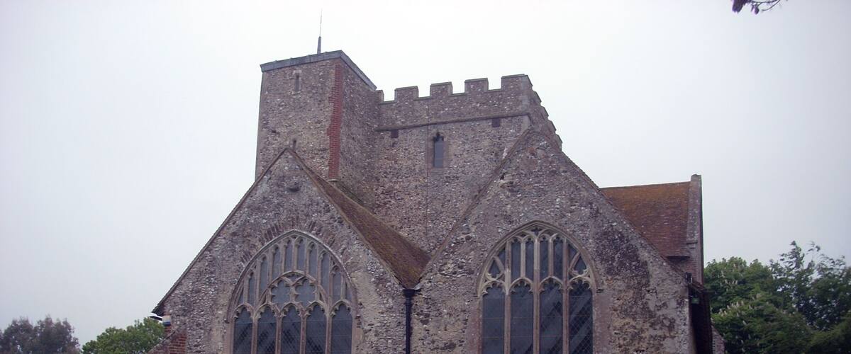 A historic church with Gothic architecture, featuring pointed arches and stained glass windows.