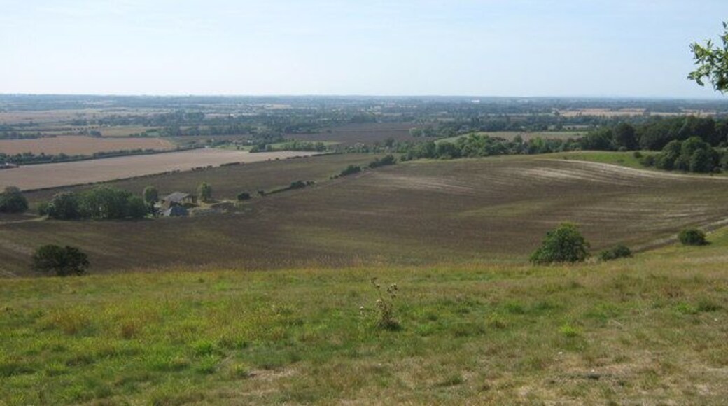 View from the North Downs Way The long distance path heads downhill towards Boughton Aluph. Wye is seen on the left in the background. Soakham Farm is in the foreground.