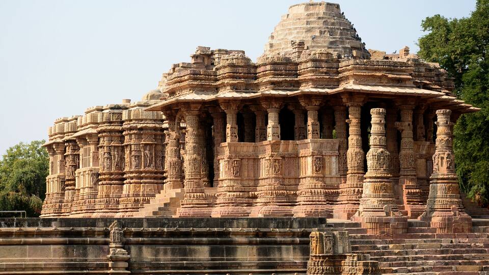 A large, intricately carved temple with multiple spires and detailed stonework.