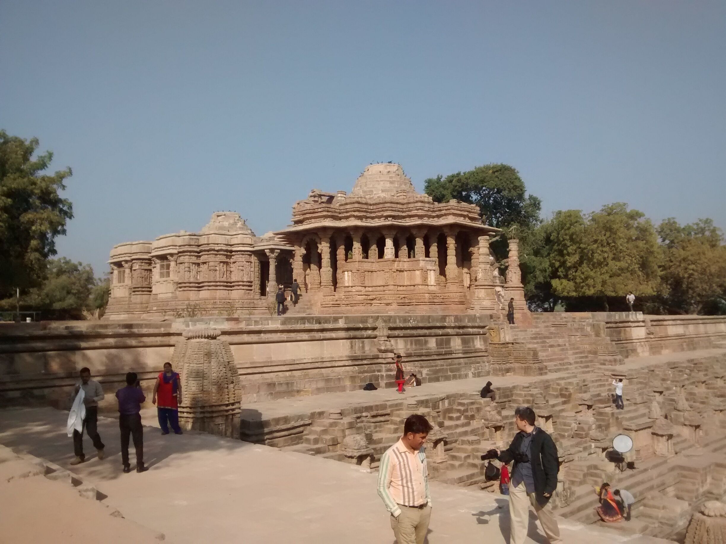 A large stone temple with intricate carvings and multiple spires.