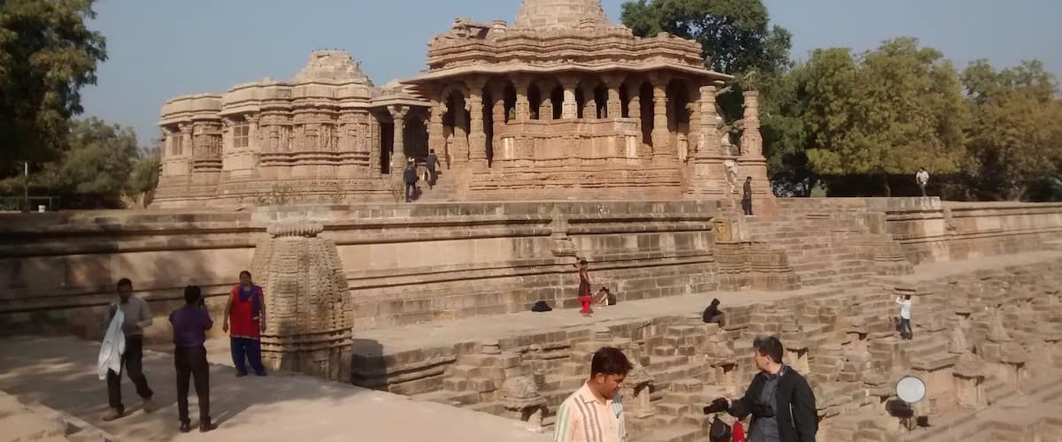 A large stone temple with intricate carvings and multiple spires.