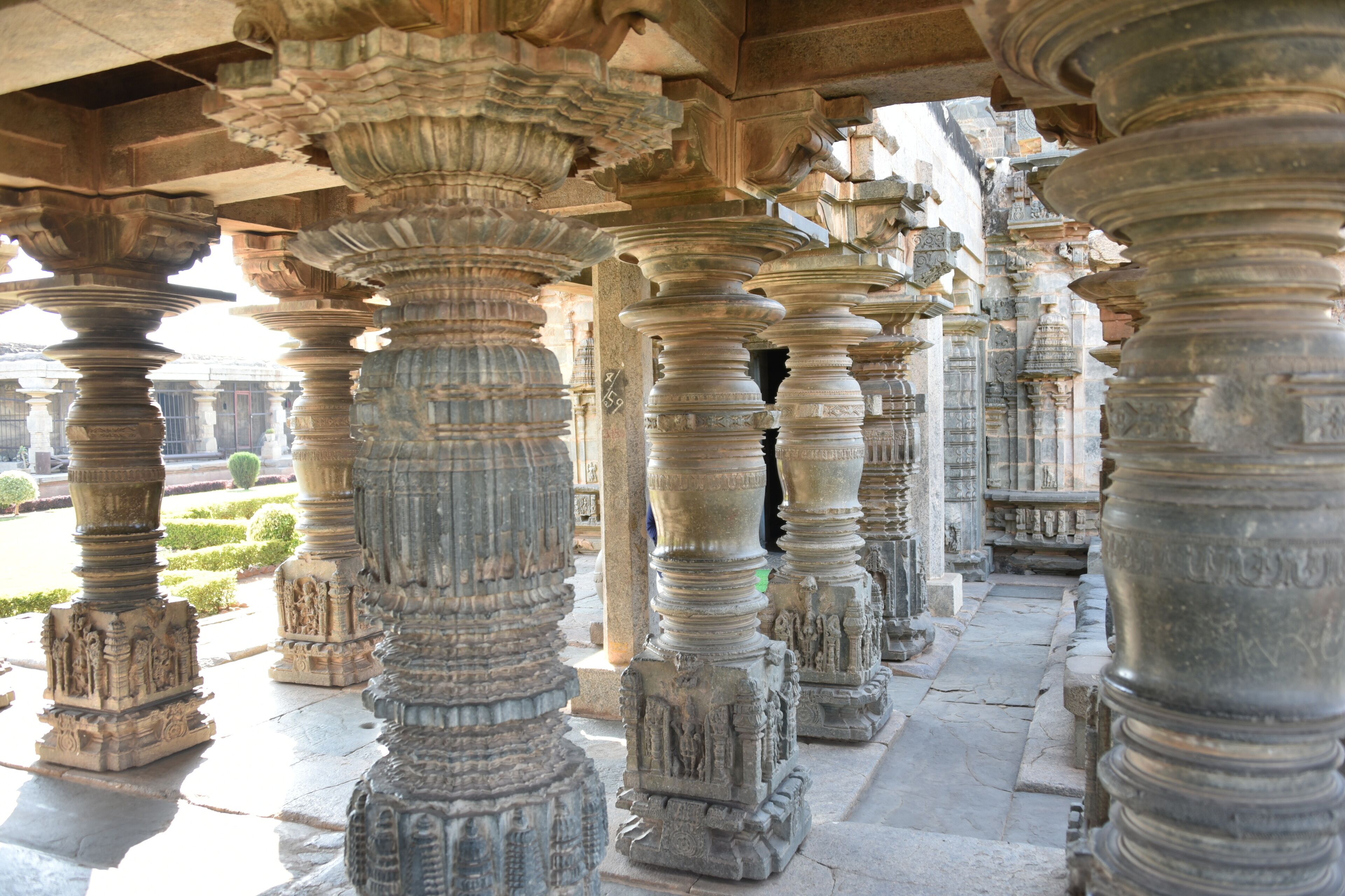 Intricately carved stone pillars in a historical building.