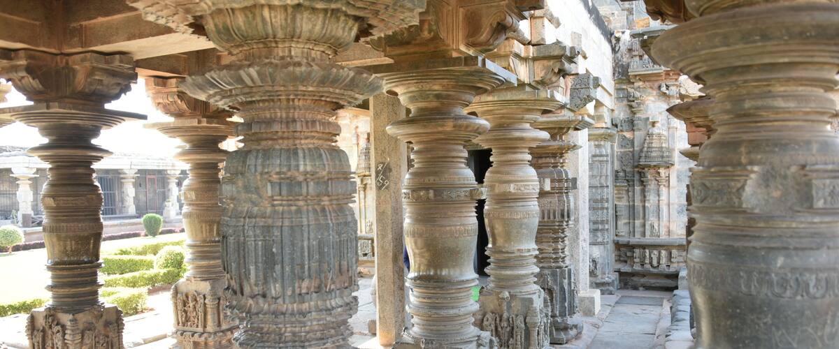 Intricately carved stone pillars in a historical building.