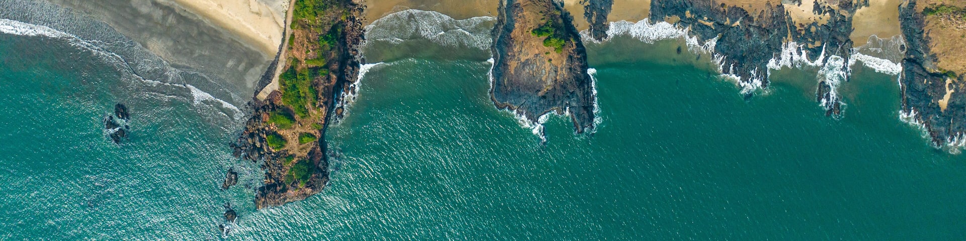 drone shot of blue water beach in maharashtra