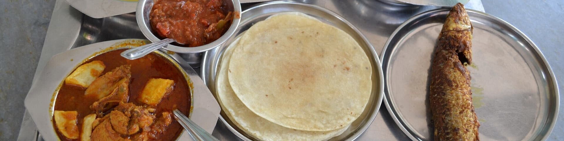 Just your typical #parsi meal in Udwada. Dal, rice, fish patio, chicken with fried potatoes, chapati, pickle and ' boi ni macchi ' which is a fried local river fish. Good times :) #thetinytaster - www.thetinytaster.com