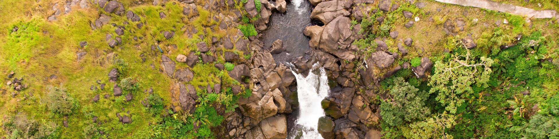Bhimashankar's Kondwal waterfall in Maharashtra, India, a serene cascade within a verdant stream.