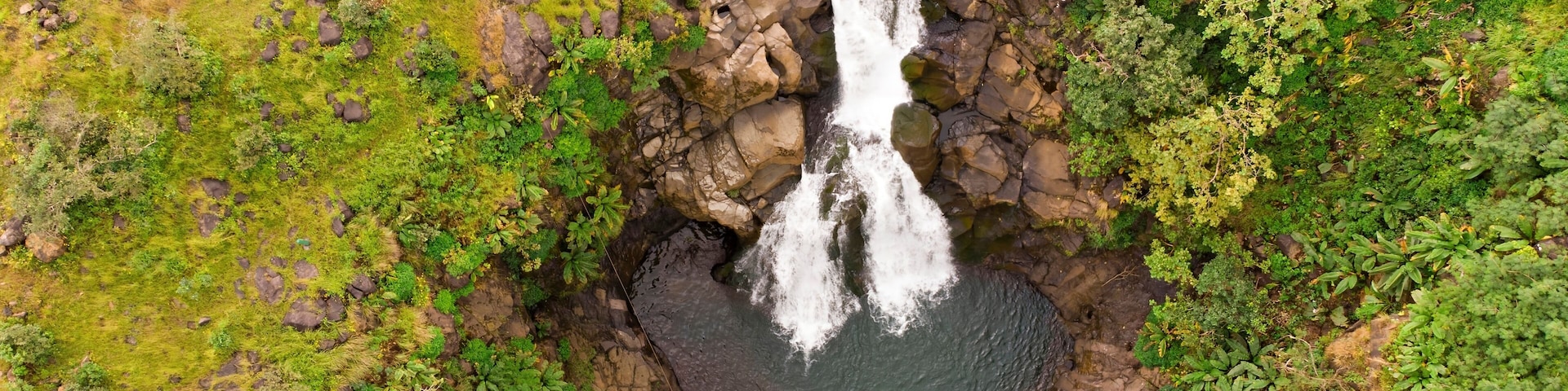 Bhimashankar's Kondwal waterfall in Maharashtra, India, a serene cascade within a verdant stream.