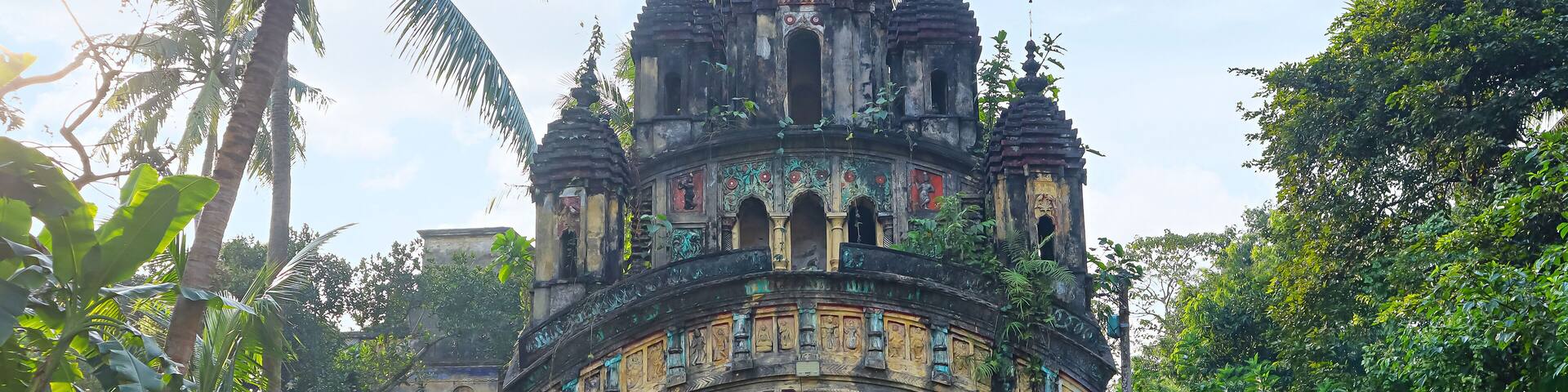 Detailed terracotta carvings of Hindu deities on the façade of the Ras Mandir at Jamindarbari, Hadal Narayanpur, Bankura, West Bengal, India.