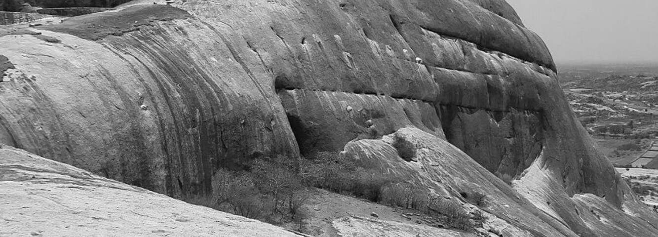April 2012
Bhongir fort
Bhongir or Bhuvanagiri fort is located ca. 50 km east from Hyderabad. Built in 12th century by local ruler Tribhuvanamahalla (hence the name Bhuvanagiri) Vikramaditya s on a vast egg-shaped monolithic rock rising 150 metres above terrain. Fortified by nature (shape of the rock) and by men (moats, walls, gates at the foot) it was almost unbreakable. Bala Hisar pavilon on top was built by Qutbshahi rulers of Golkonda kingdom (Hyderabad) in 17th century and it gives truly birdview perspective of the surrounding land and Bhongir town bellow. Beware to go up the rock soon after sunrise or before sunset as the stone gets hot during the day making the hike much more demanding.