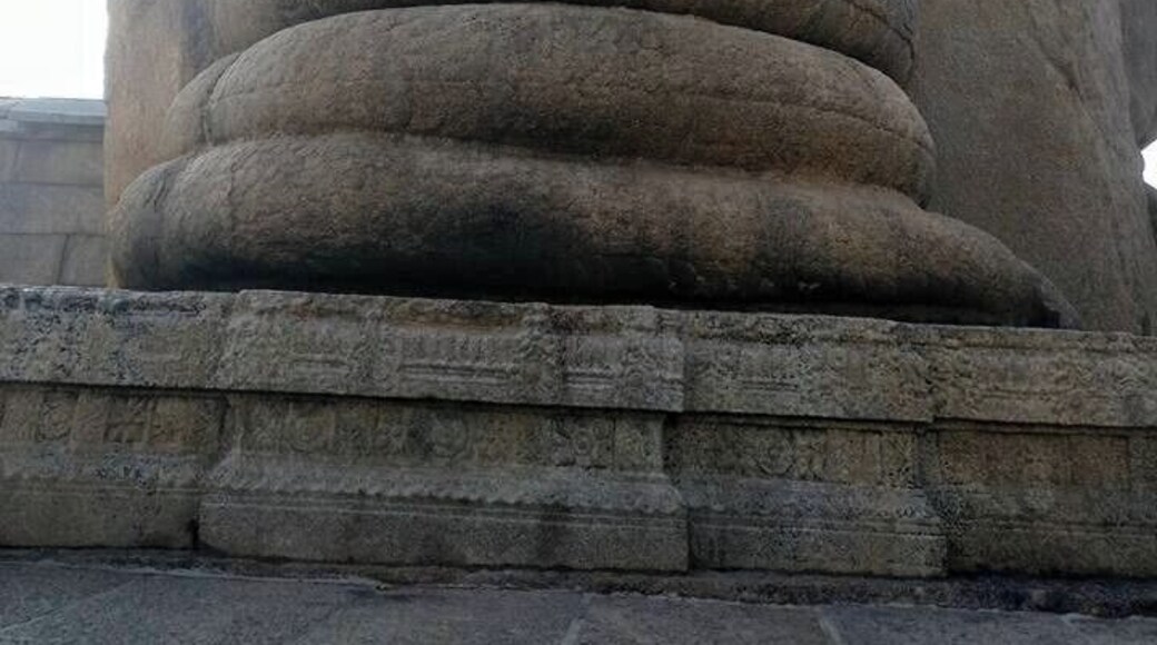 Shivalinga with serpent carved on a single rock, which extends to some area at the back