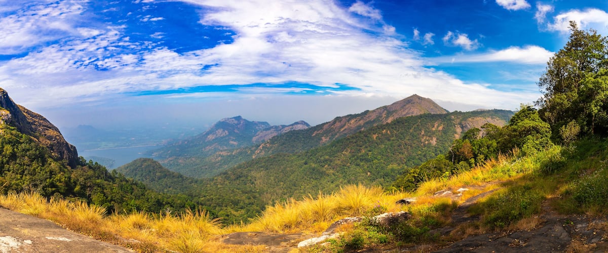 A mountainous landscape with a clear sky and distant mountains.