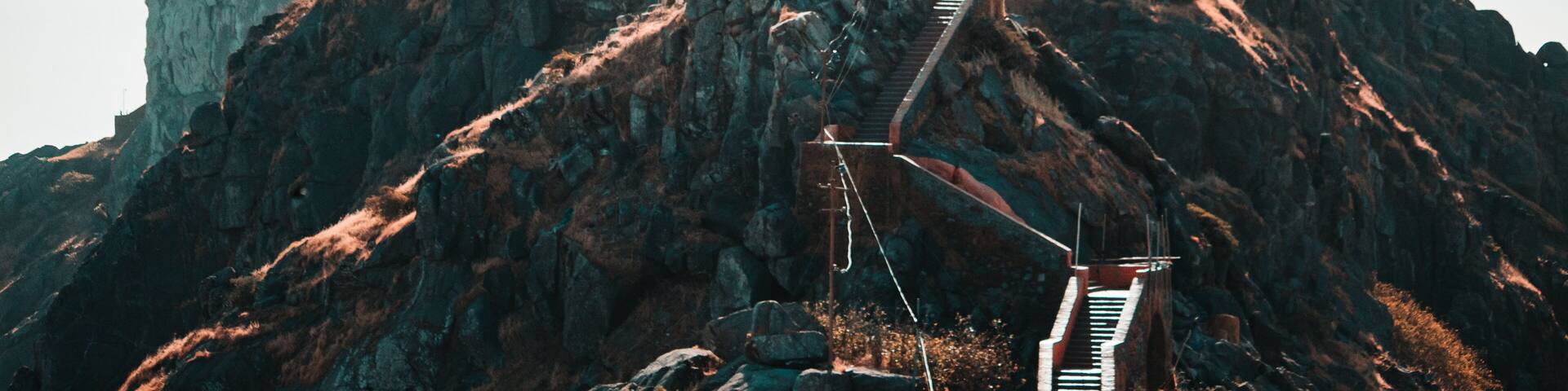 View of the Gorkhnath temple as seen from Ambaji Temple at the top of Mount Girnar in Junagadh, Gujarat, India