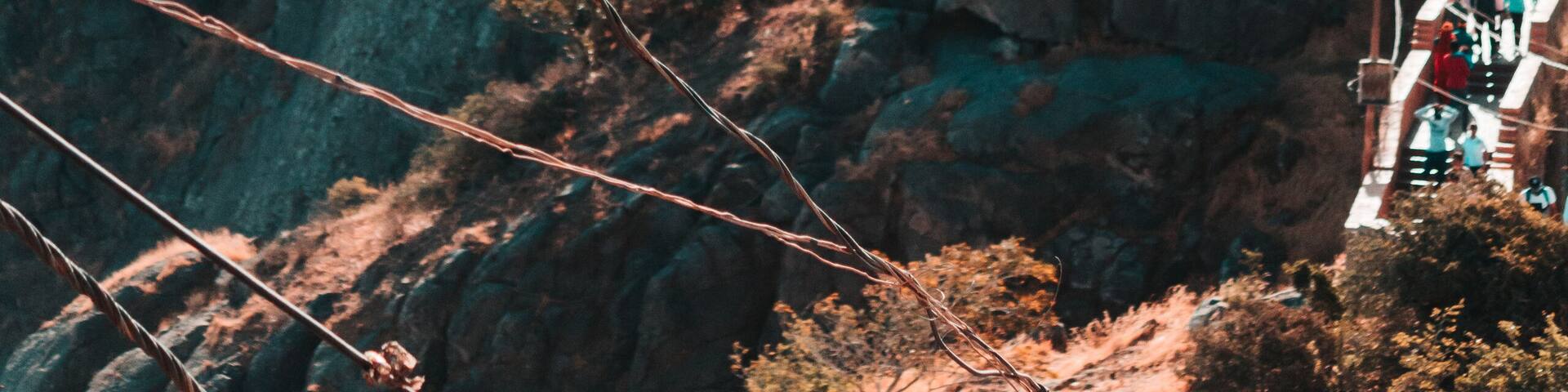 View of the Gorkhnath temple as seen from Ambaji Temple at the top of Mount Girnar in Junagadh, Gujarat, India