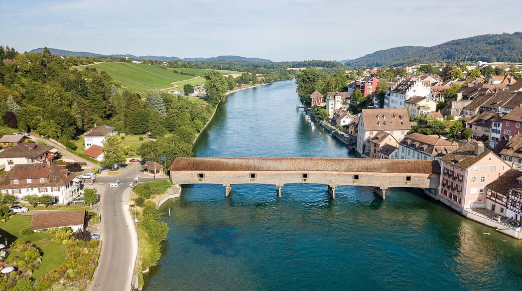 Aerial image the old wooden covered bridge over the Rhine river, which connects the Swiss old town Diessenhofen and German town Gailingen.