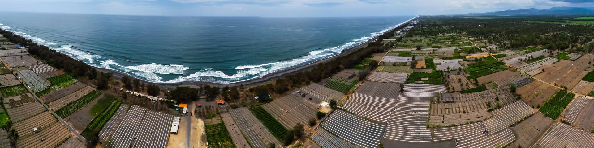 Full seamless spherical hdri panorama 360 degrees angle aerial view of Agricultural land such as rice fields, vegetable gardens and coconut plantations in coastal areas in Kulon Progo, Yogyakarta.