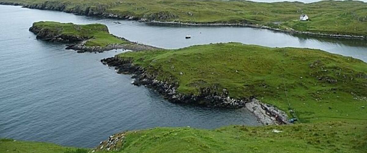 Stuaidh Peninsula From this viewpoint the whole of the peninsula can be seen, with Bàgh Bhorghasdail to the right and Loch Roghadail to the left. In the far distance, beyond the intervening skerries in the Sound of Harris, is the faint outline of the Isle of Skye on the horizon.