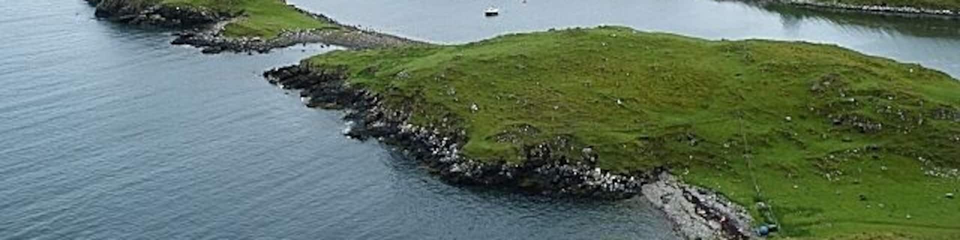 Stuaidh Peninsula From this viewpoint the whole of the peninsula can be seen, with Bàgh Bhorghasdail to the right and Loch Roghadail to the left. In the far distance, beyond the intervening skerries in the Sound of Harris, is the faint outline of the Isle of Skye on the horizon.