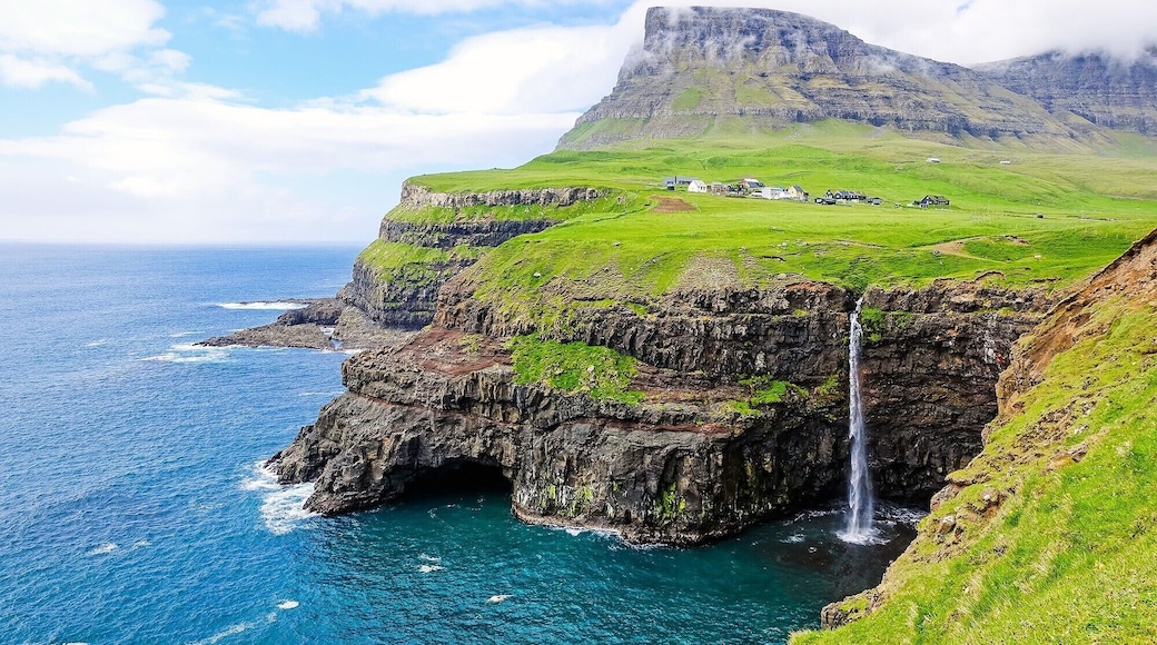Denmark’s Faroe Islands is never short of natural wonders. In fact, the surreal landscape in Gasadalur + Mulafossur Waterfall is sure to make your jaw drop!
Read more here: https://iamaileen.com/gasadalur-mulafossur-waterfall-vagar-faroe-islands-hiking-guide/