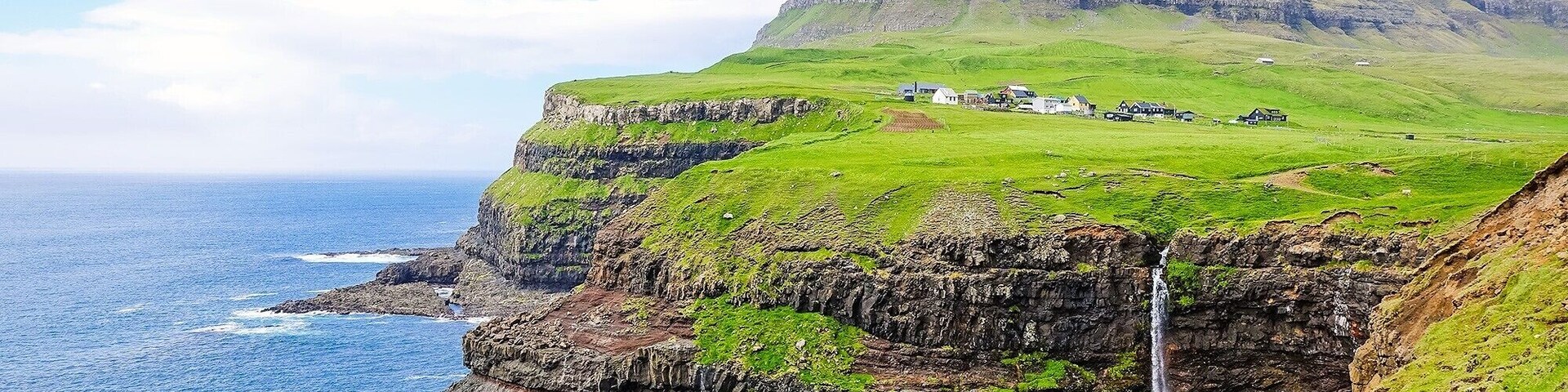 Denmark’s Faroe Islands is never short of natural wonders. In fact, the surreal landscape in Gasadalur + Mulafossur Waterfall is sure to make your jaw drop!
Read more here: https://iamaileen.com/gasadalur-mulafossur-waterfall-vagar-faroe-islands-hiking-guide/