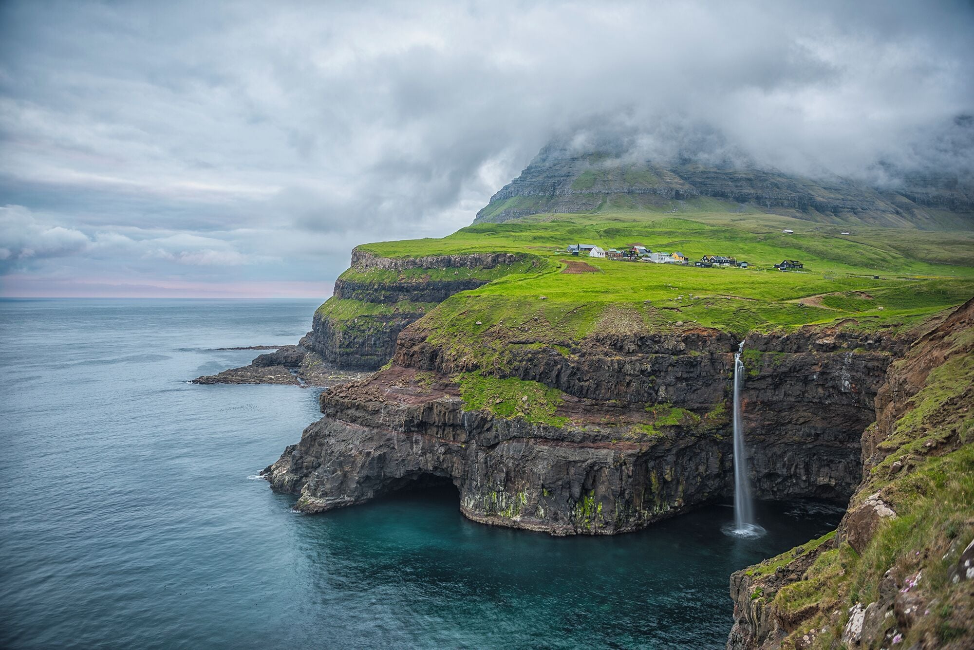 Vagar is #green. The small town here was cut off from the mainland unless you walked around the mountain until a few years ago when they completed the tunnel. It is an absolute place to visit and capture the waterfall Gasadalur fall into the sea. #greenpower