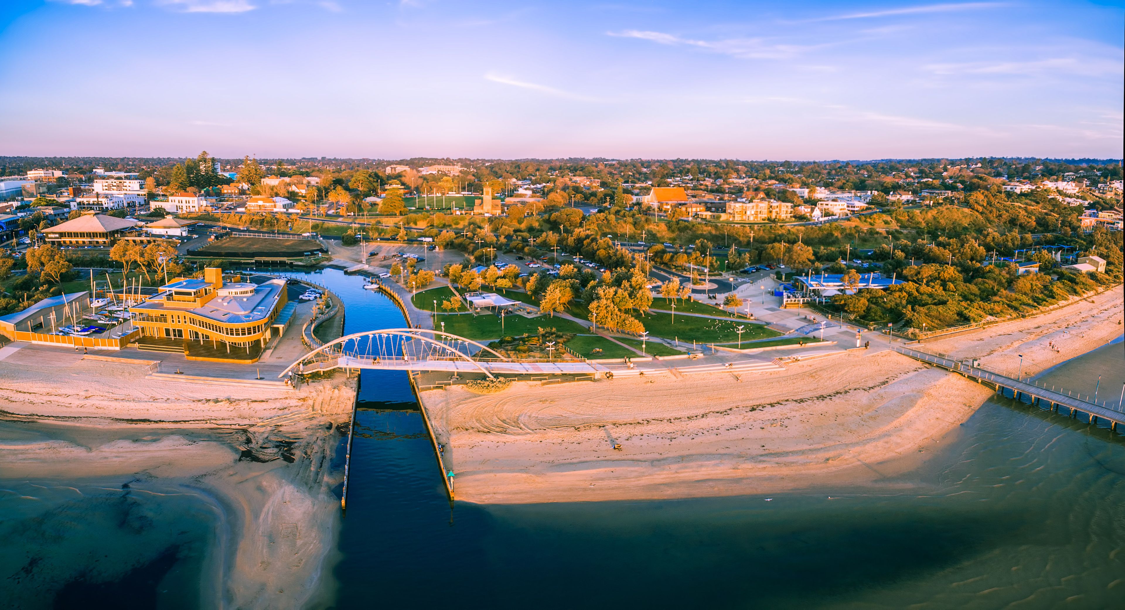 Aerial panorama of Frankston waterfront at sunset. Frankston yacht club and footbridge over Kananook creek.