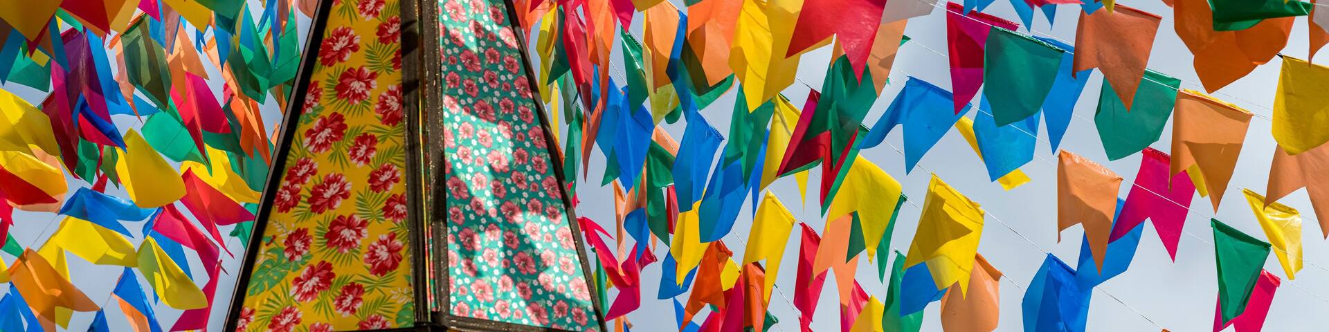 Colorful flags and decorative balloons for the São João festival, with blue skies, which takes place in June in the northeast of Brazil.