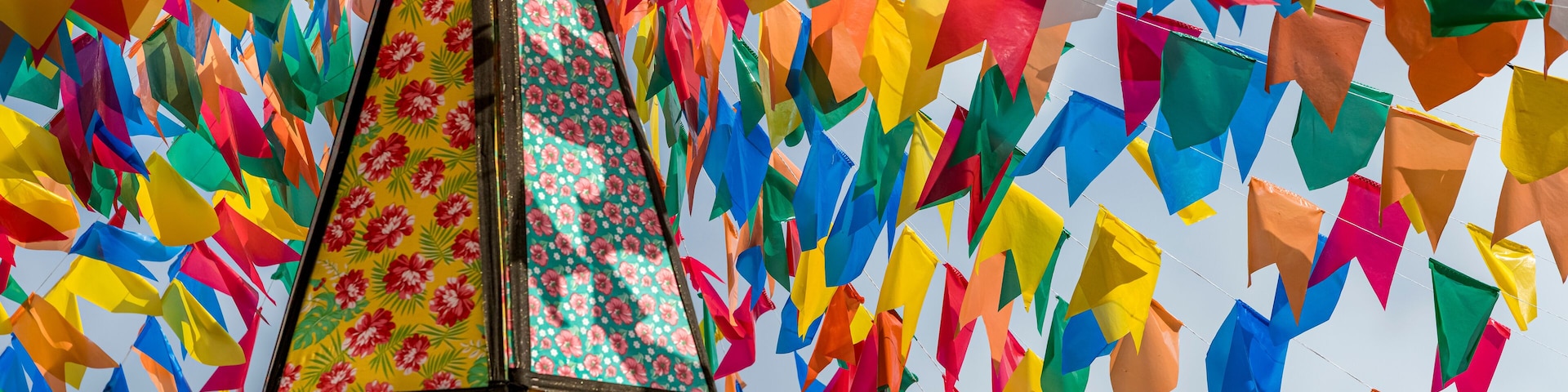 Colorful flags and decorative balloons for the São João festival, with blue skies, which takes place in June in the northeast of Brazil.