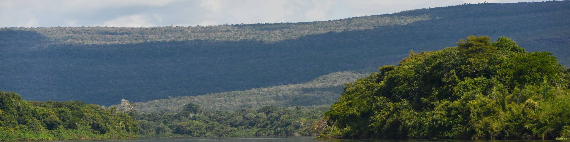 The rainforest-lined Guaporé-Itenez river and the rugged hills of the Noel Kempff Mercado National Park, near Cabixi, Rondonia state, Brazil, on the border with Santa Cruz Department, Bolivia